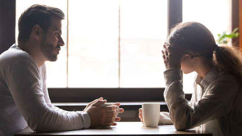 Sad couple at a coffee shop
