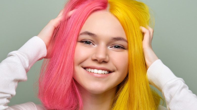 Smiling girl with pink and yellow hair
