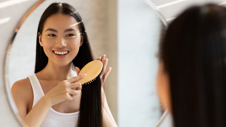 Woman brushing her hair 