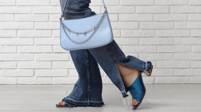 A model poses in split-hem jeans.