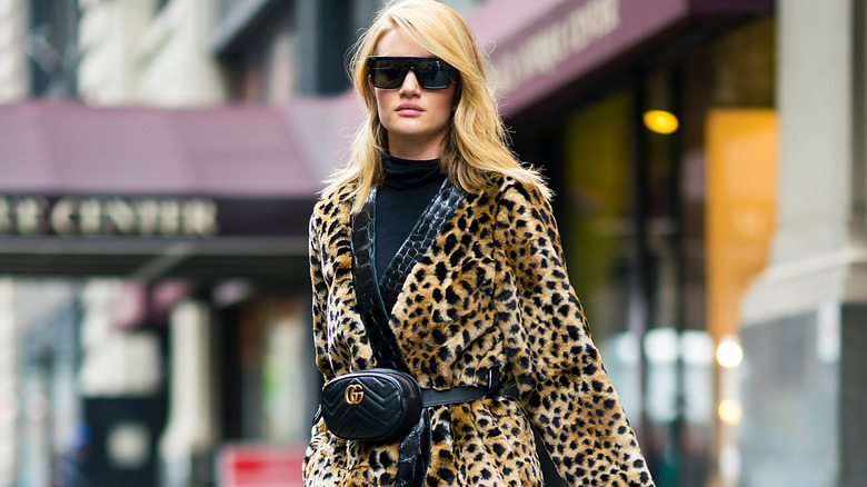model wearing leopard fur coat