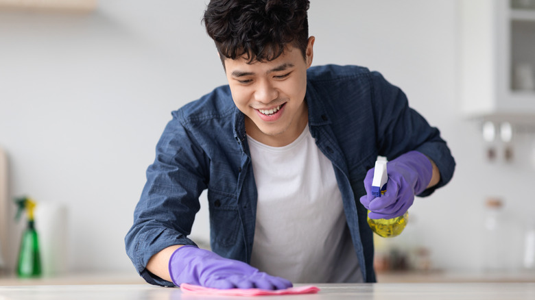 Man cleaning his kitchen