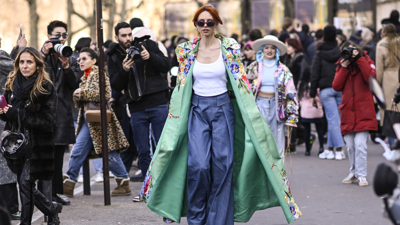 woman wearing green maxi coat