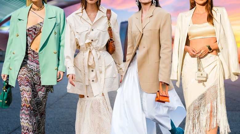 four women with long coats