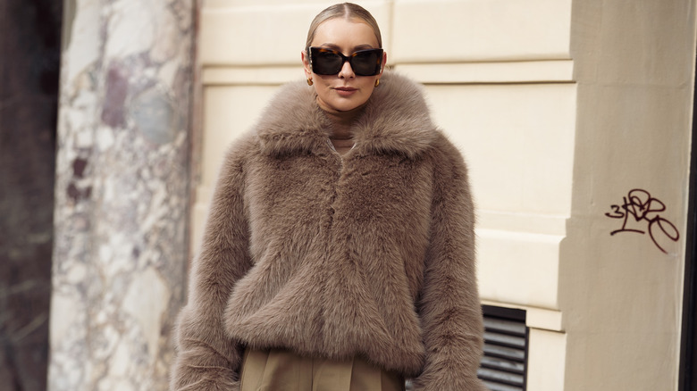 Woman wearing gray fur coat