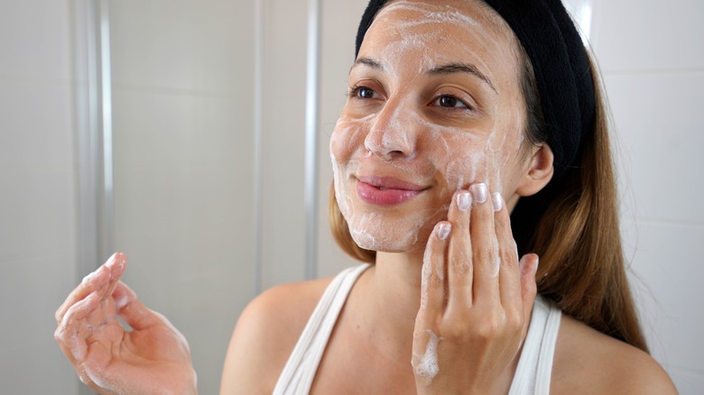 woman scrubbing skin