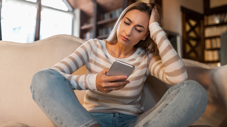 Woman holding her phone