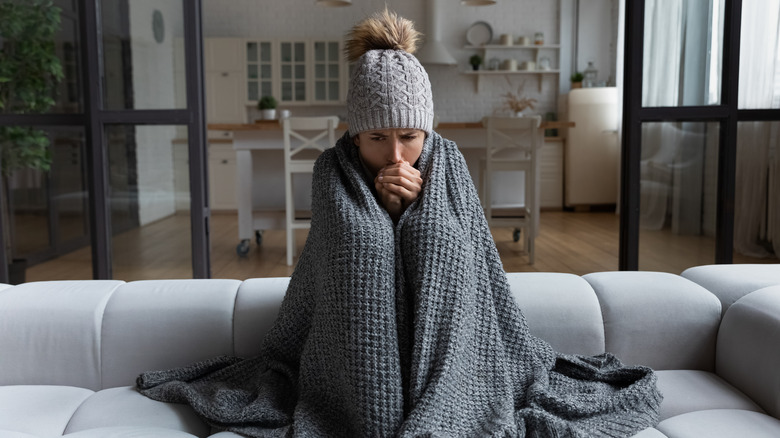 cold woman wrapped in blanket