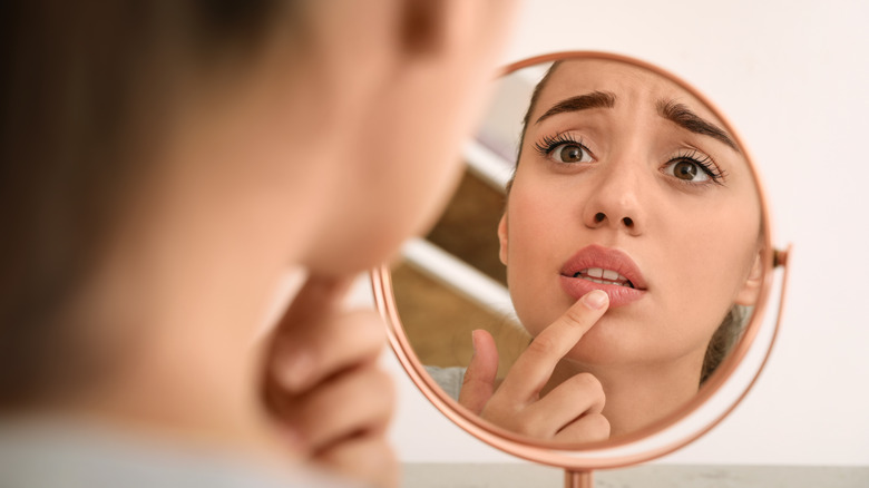 Woman looking in the mirror