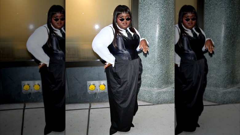 Gabourey Sidibe in a black corset top and white shirt