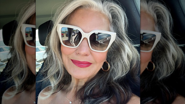 Woman wearing white sunglasses