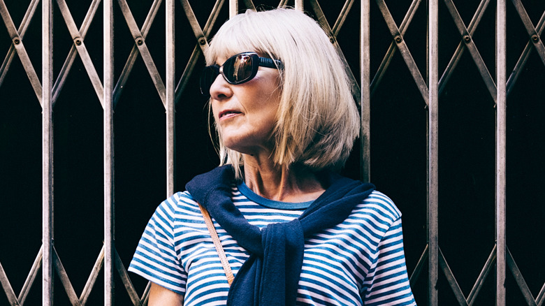 Woman wearing a striped shirt and sweater