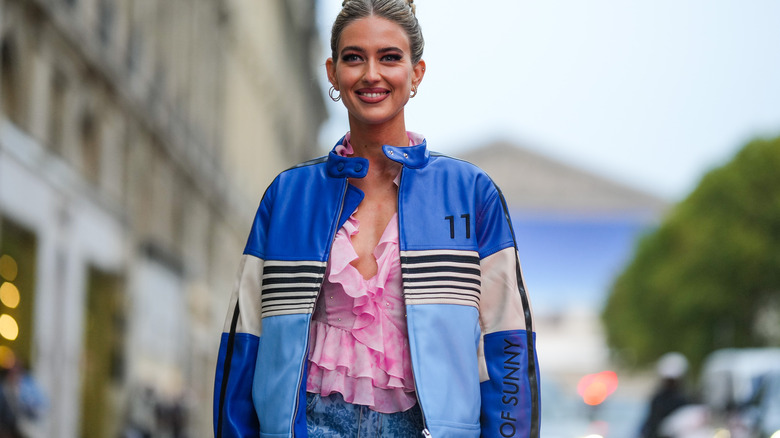 woman wearing blue leather biker jacket