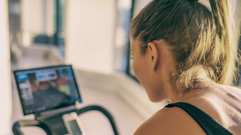 Woman on digital exercise bike