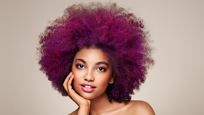 woman with purple colored afro