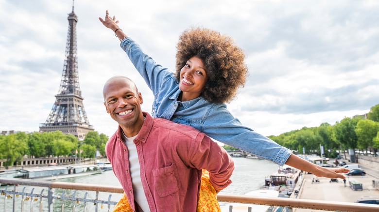 Couple posing with Eiffel Tower 