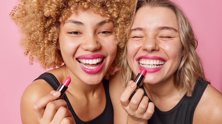 Girls enjoy their lipstick 
