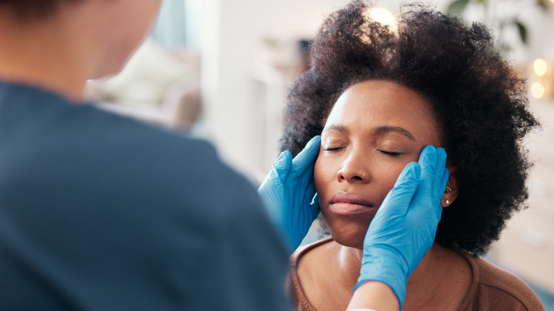 Woman consults skincare professional