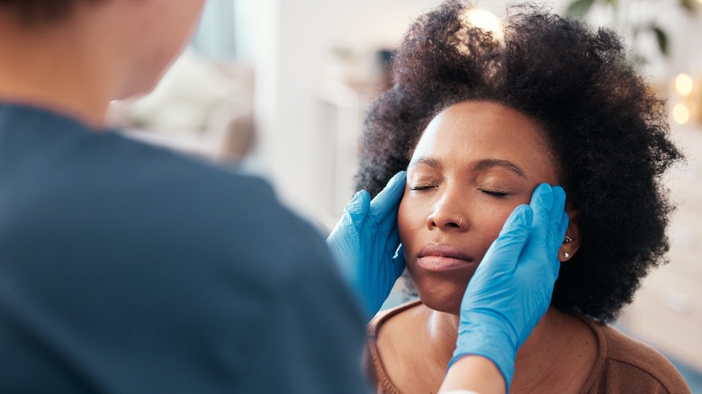 Woman consults skincare professional 