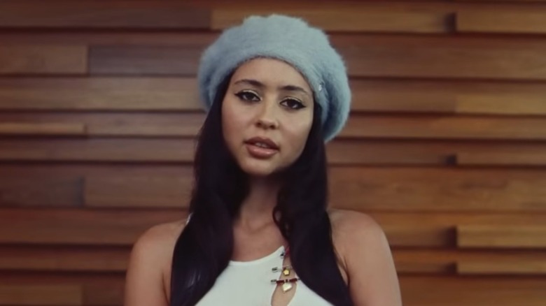 Maddy Perez wearing makeup and a hat