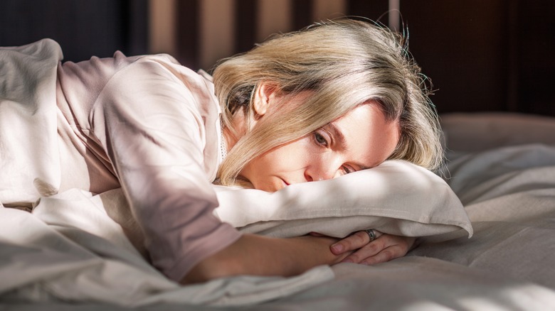 Woman stressed in bed