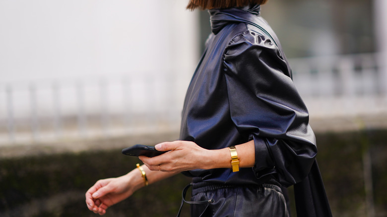 woman wearing gold bangles