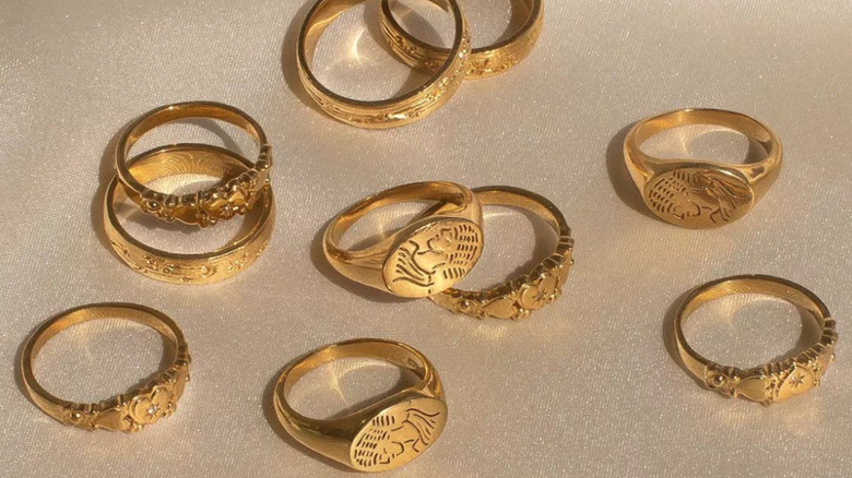 set of gold rings with different carvings