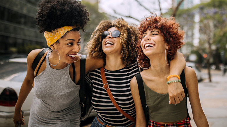 friends laughing on street