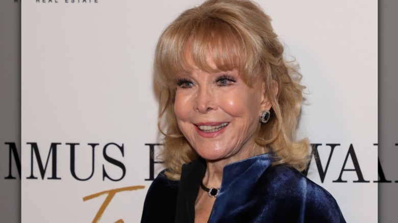 Barbara Eden at an event in 2023 wearing sapphires and blue