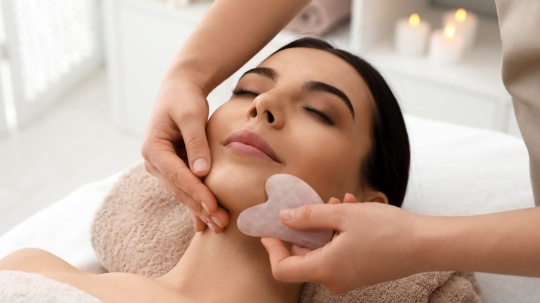Woman receiving gua sha massage