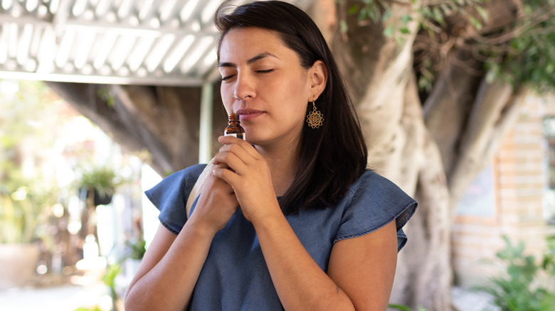 woman trying on new perfume