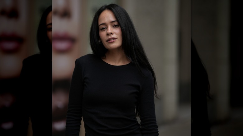 A woman with long jet-black hair.
