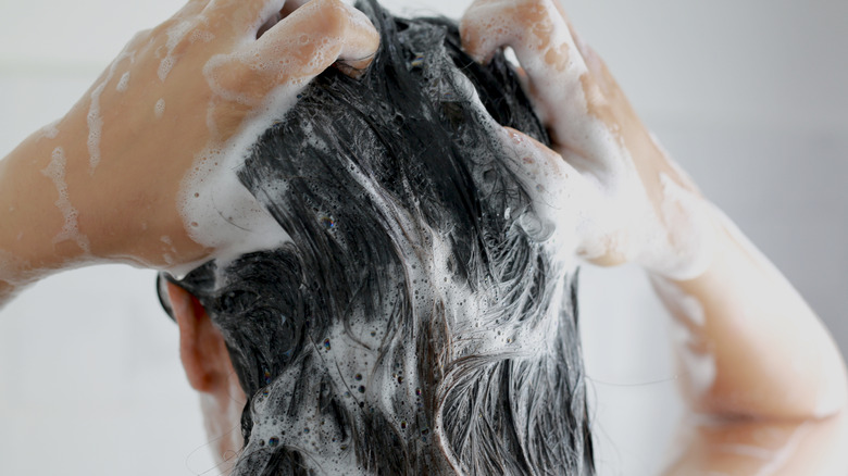 Woman shampooing her hair
