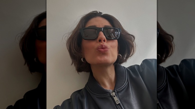 A woman with a choppy brunette bob