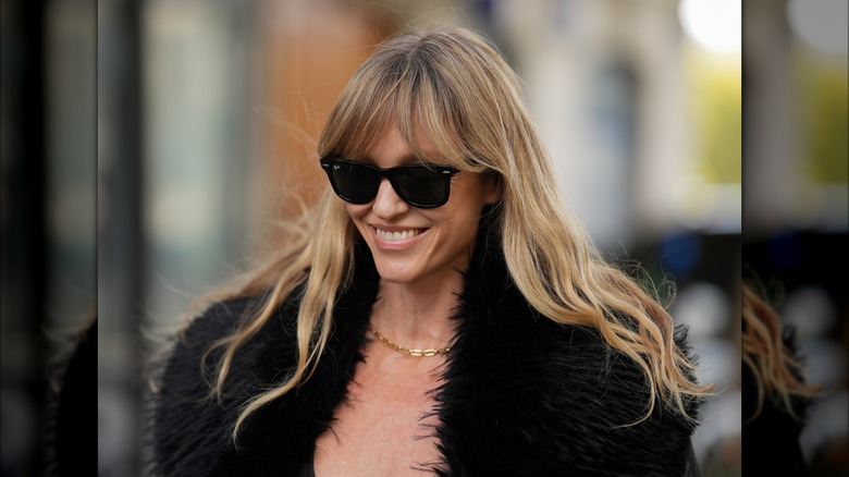 A woman with curtain bangs