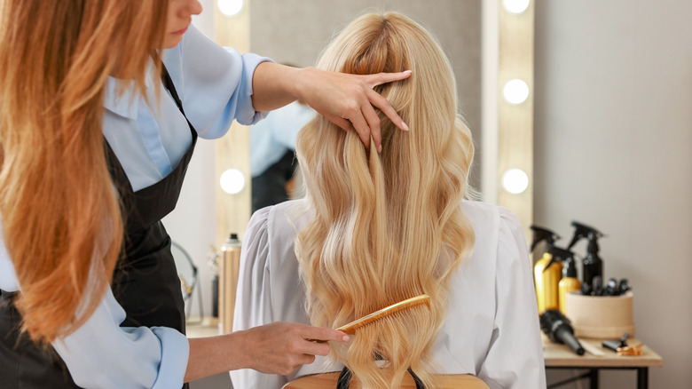A woman getting a haircut