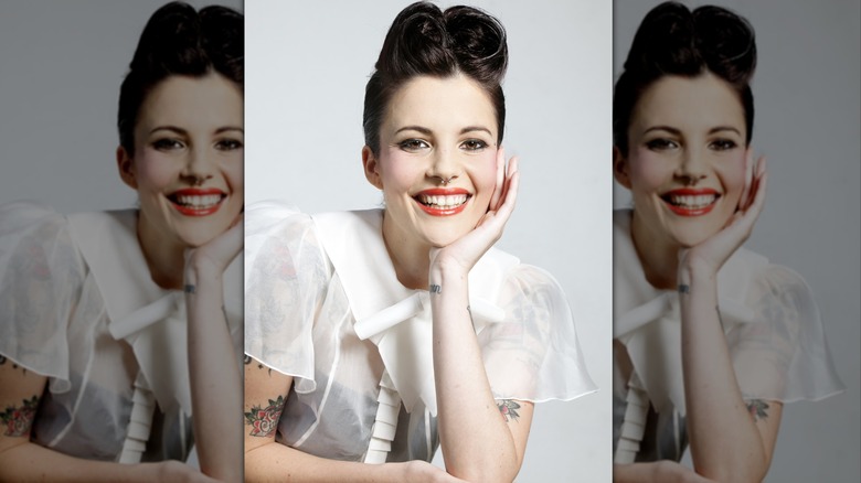 A woman wearing a 50s-style quiff