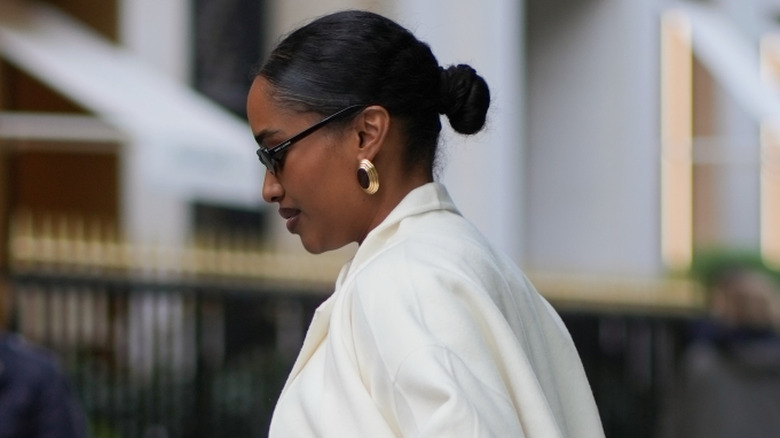 A woman with a sleek black bun