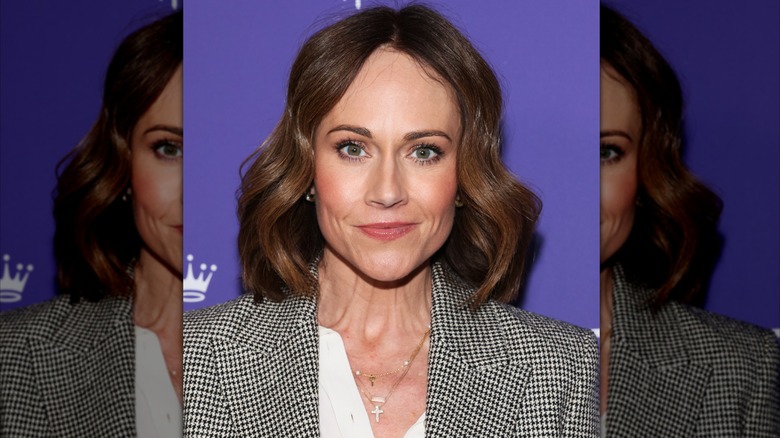 Nikki DeLoach smiles with her dark brown hair cut to her shoulders