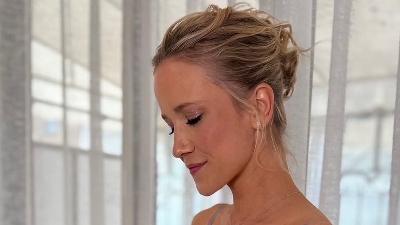 Jessy Schram poses with her eyes closed to show off her look