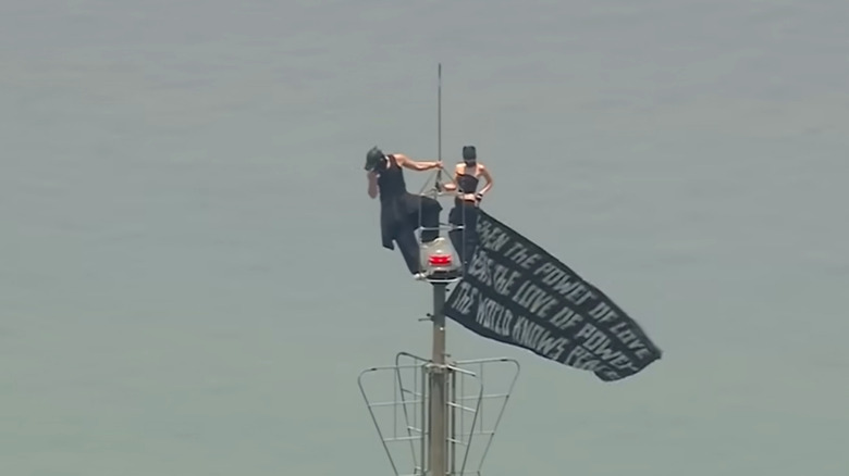 Couple protesting on top of the Empire State Building