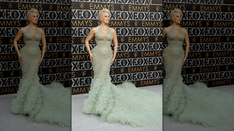 Hannah Waddingham at the 2024 Emmy Awards wearing a pale green gown with a long ruffled train.