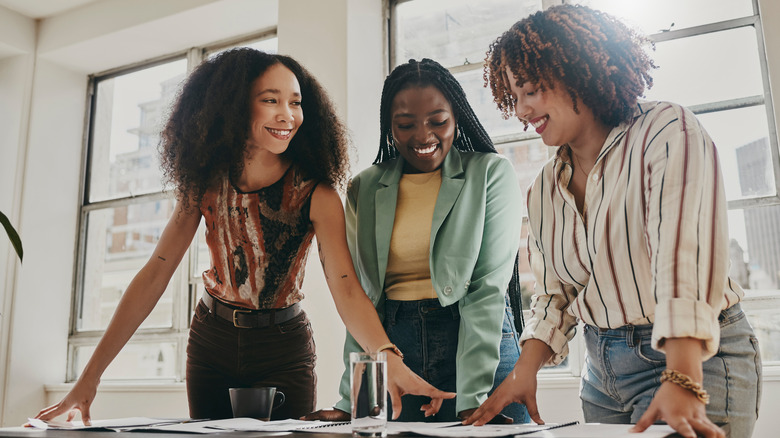 Smiling working women in office