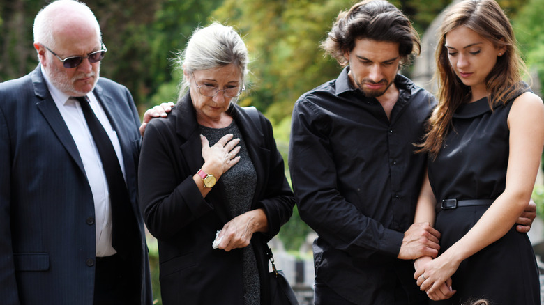 funeral mourners in black attire