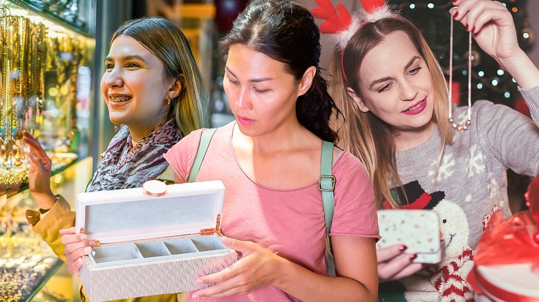 Three women looking at jewelry