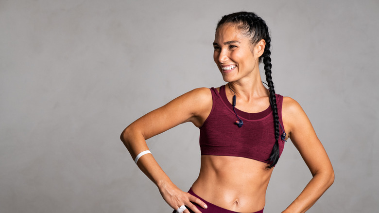 happy woman wearing sports bra