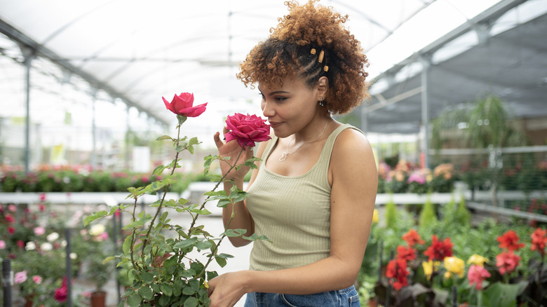 Woman smelling roses