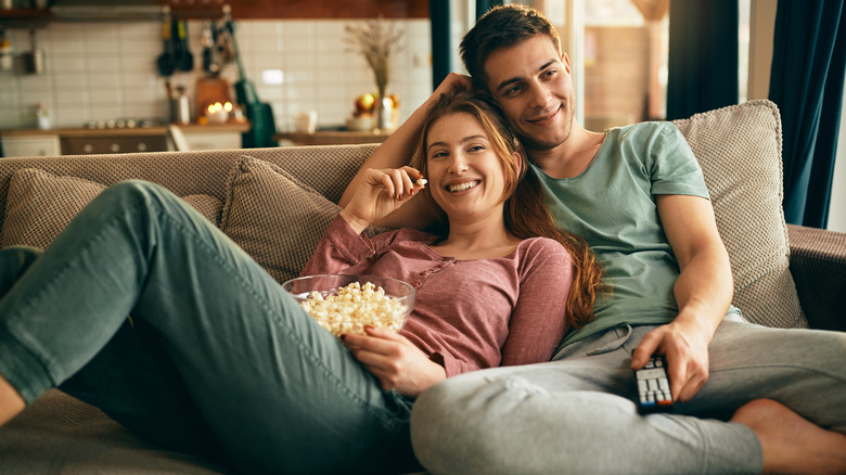 couple on couch with remote