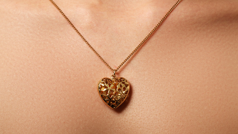 person wearing a heart locket