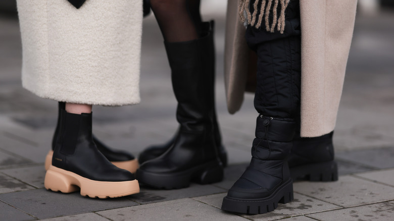 close up of three pairs of boots